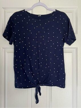 Navy blue and white polka dot top with tie detail